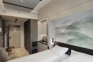 Фото номера Двухместный номер «Смарт» с 1 кроватью Отель VALO Hotel Helsinki г. Хельсинки 2