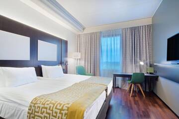 Фото номера Двухместный номер с 2 отдельными кроватями Отель Holiday Inn Helsinki West - Ruoholahti г. Хельсинки 16