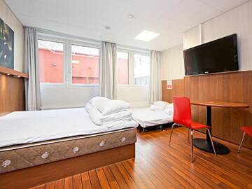 Фото номера Семейный номер Отель Omena Hotel Helsinki City Centre г. Хельсинки 6