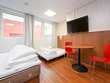 Фото номера Семейный номер Отель Omena Hotel Helsinki Lönnrotinkatu г. Хельсинки 18