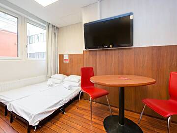 Фото номера Семейный номер Отель Omena Hotel Helsinki Lönnrotinkatu г. Хельсинки 19