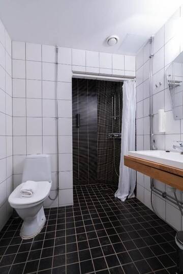 Фото номера Двухместный номер эконом-класса с 2 отдельными кроватями, без окон Отель Hotel Midpoint Helsinki г. Хельсинки 13