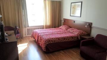 Фото номера Стандартный двухместный номер с 2 отдельными кроватями Отель Hotel Anna г. Хельсинки 6